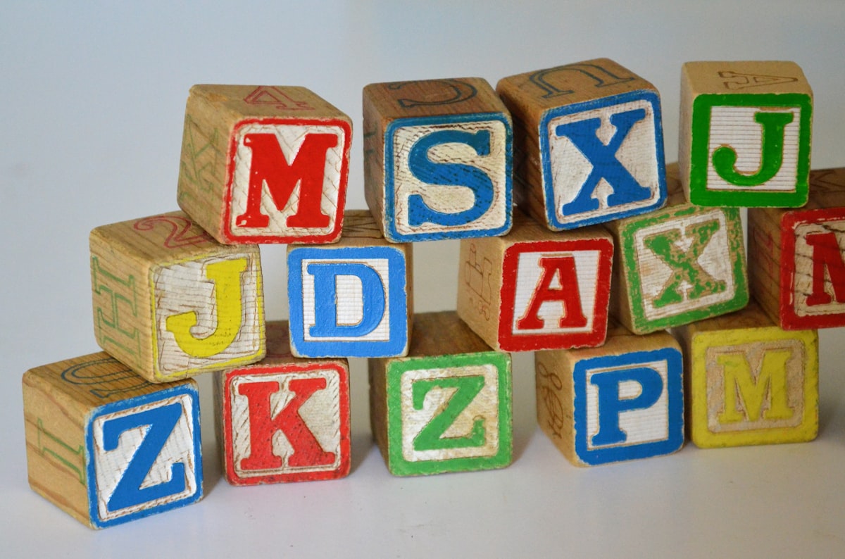Colorful wooden alphabet blocks arranged on a surface