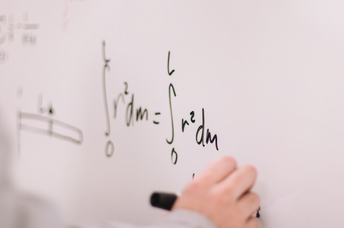 A student practicing probability problems with worksheets