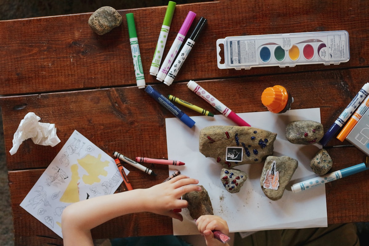 Children working on clock activities with colorful materials